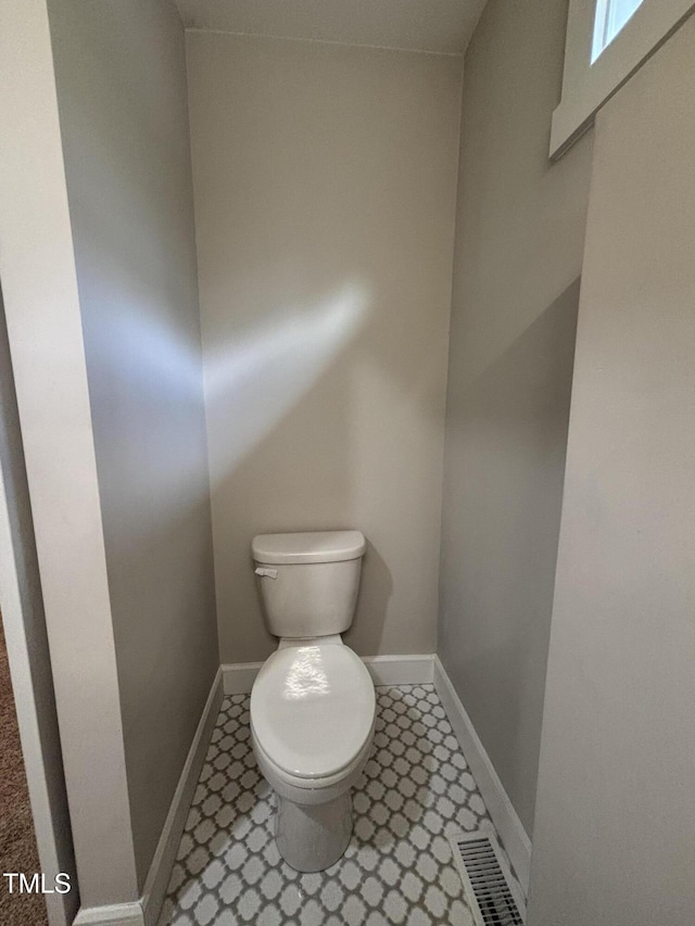1119 Sagamore Dr, Louisburg, NC 27549 - bathroom with toilet and baseboards