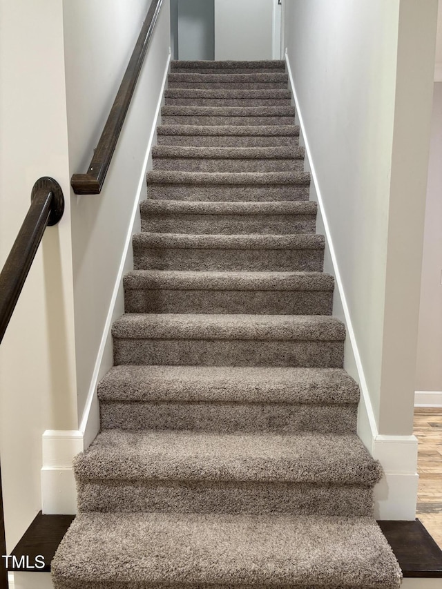 1119 Sagamore Dr, Louisburg, NC 27549 - staircase with wood finished floors