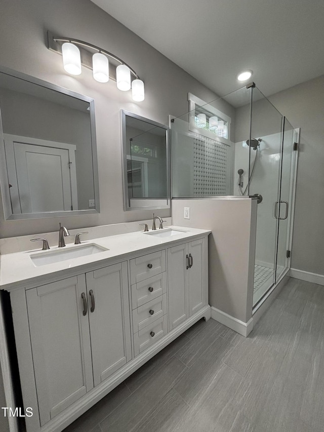 1119 Sagamore Dr, Louisburg, NC 27549 - bathroom featuring a shower stall and double vanity
