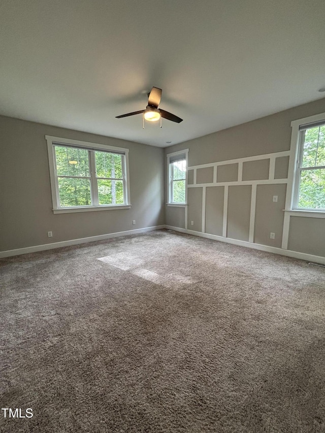 1119 Sagamore Dr, Louisburg, NC 27549 - carpeted spare room with plenty of natural light and ceiling fan