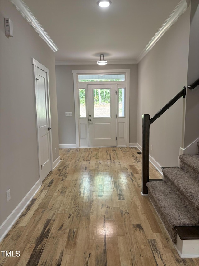 1119 Sagamore Dr, Louisburg, NC 27549 - foyer entrance featuring crown molding, wood finished floors, and stairs