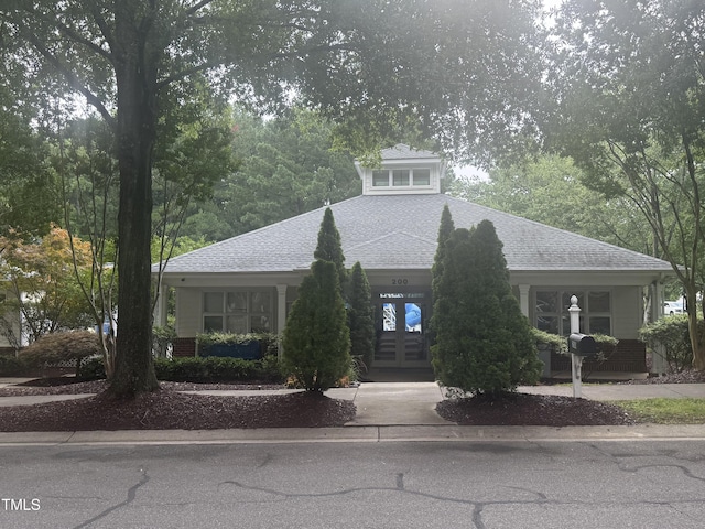 241 Commons Dr, Holly Springs, NC 27540 - view of front of house featuring roof with shingles and french doors