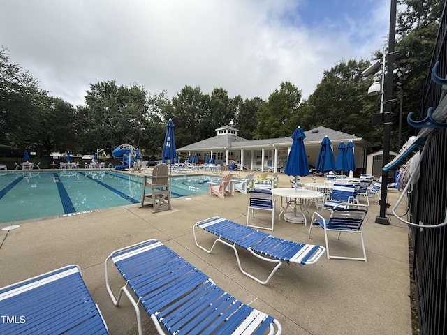 241 Commons Dr, Holly Springs, NC 27540 - community pool with a patio area