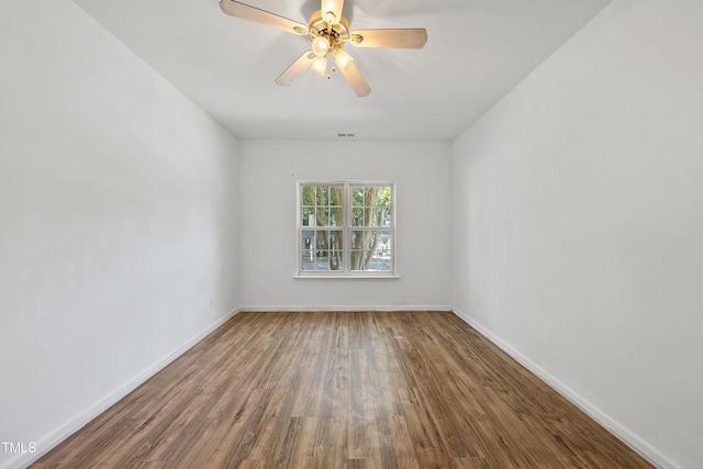 241 Commons Dr, Holly Springs, NC 27540 - spare room with wood finished floors and ceiling fan