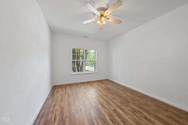 241 Commons Dr, Holly Springs, NC 27540 - empty room featuring wood finished floors and ceiling fan