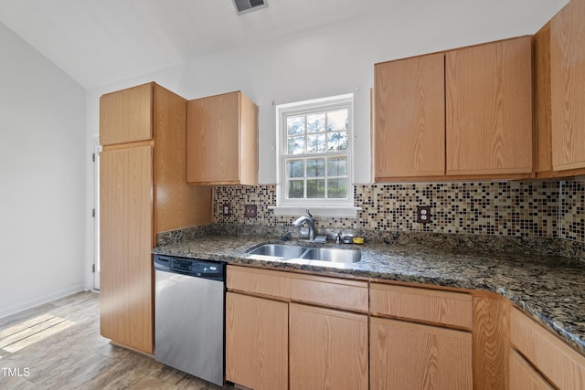 241 Commons Dr, Holly Springs, NC 27540 - kitchen featuring dishwasher, light wood-style flooring, decorative backsplash, dark stone counters, and lofted ceiling