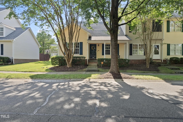 241 Commons Dr, Holly Springs, NC 27540 - view of front of house with a front lawn and roof with shingles
