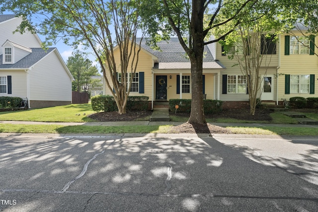 241 Commons Dr, Holly Springs, NC 27540 - view of front of house with a front yard and roof with shingles