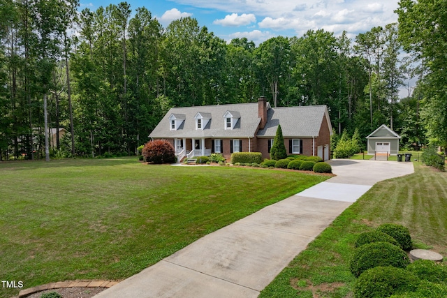 4135 Somerset Dr, Oxford, NC 27565 - cape cod-style house featuring a chimney, a front lawn, brick siding, and driveway