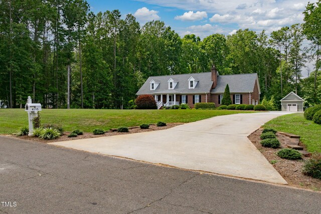 4135 Somerset Dr, Oxford, NC 27565 - new england style home featuring a chimney, a front lawn, concrete driveway, and an outbuilding
