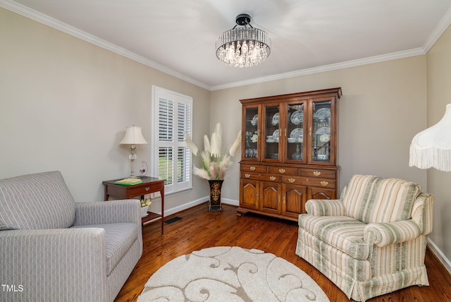 4135 Somerset Dr, Oxford, NC 27565 - living area featuring a chandelier, ornamental molding, and wood finished floors
