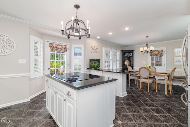 4135 Somerset Dr, Oxford, NC 27565 - kitchen featuring a chandelier, black electric cooktop, dark countertops, a center island, and recessed lighting