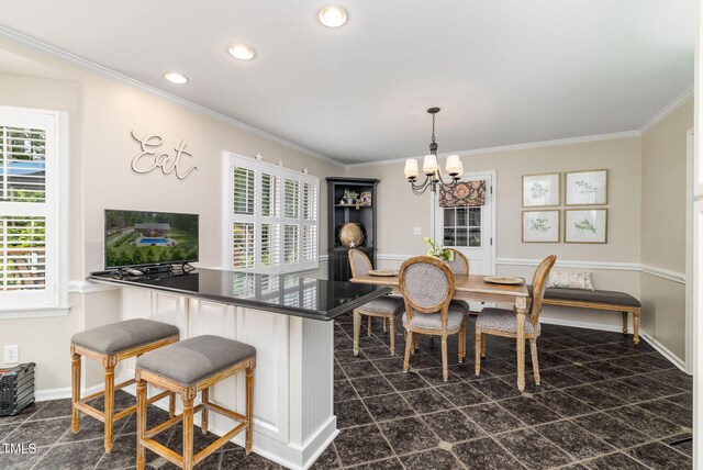 4135 Somerset Dr, Oxford, NC 27565 - dining space featuring a chandelier, plenty of natural light, crown molding, and recessed lighting