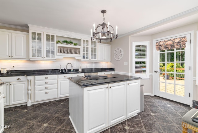4135 Somerset Dr, Oxford, NC 27565 - kitchen featuring a chandelier, dark countertops, black electric stovetop, a center island, and white cabinets