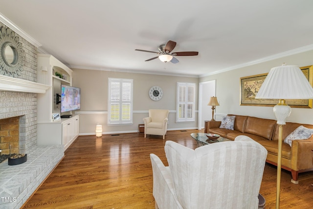 4135 Somerset Dr, Oxford, NC 27565 - living area featuring ceiling fan, a fireplace, light wood-type flooring, and ornamental molding