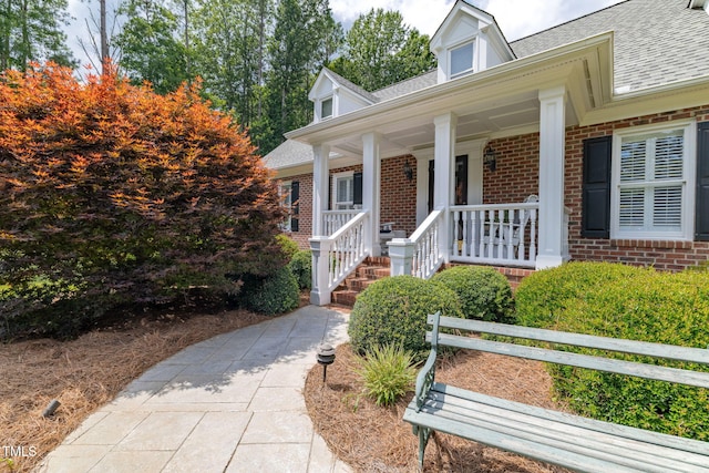 4135 Somerset Dr, Oxford, NC 27565 - view of front of home with brick siding, roof with shingles, and a porch
