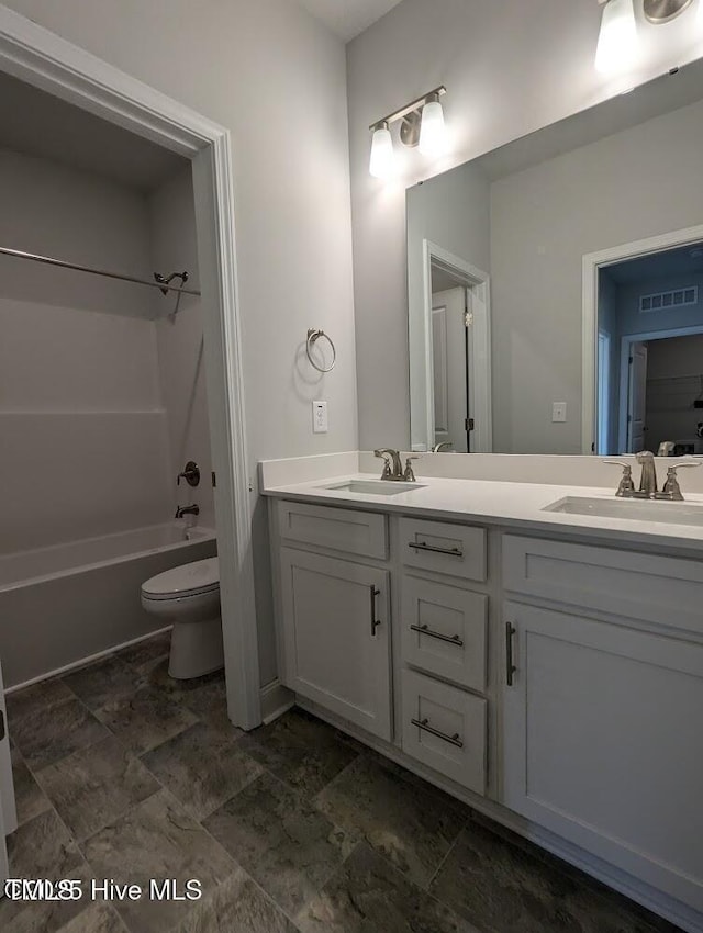 5677 Red Oak Battleboro Rd Lot 3, Battleboro, NC 27809 - bathroom with double vanity, tub / shower combination, and stone finish floors