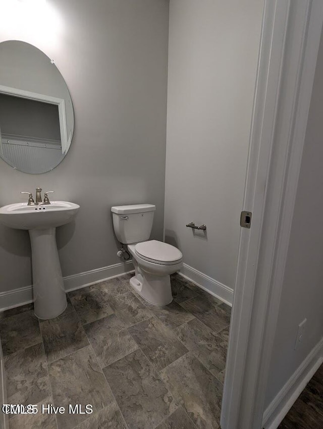 5677 Red Oak Battleboro Rd Lot 3, Battleboro, NC 27809 - half bath with toilet and stone finish flooring