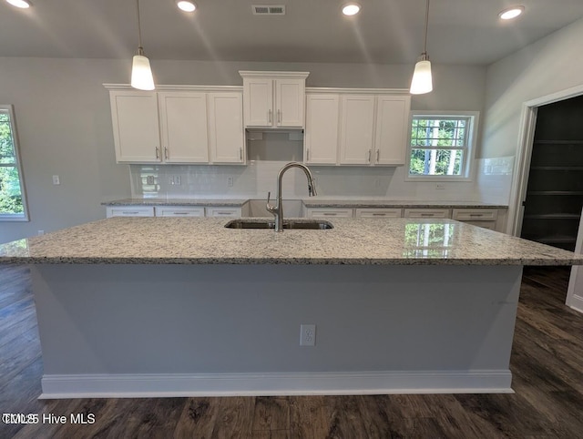 5677 Red Oak Battleboro Rd Lot 3, Battleboro, NC 27809 - kitchen featuring a center island with sink, white cabinets, light stone counters, pendant lighting, and recessed lighting