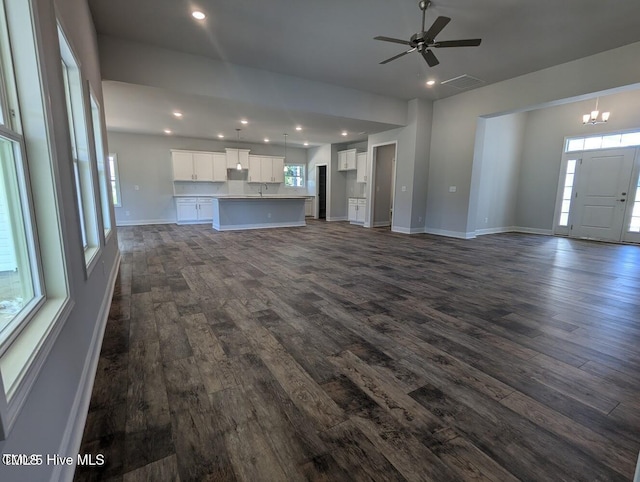 5677 Red Oak Battleboro Rd Lot 3, Battleboro, NC 27809 - unfurnished living room with dark wood finished floors, recessed lighting, a ceiling fan, and a chandelier