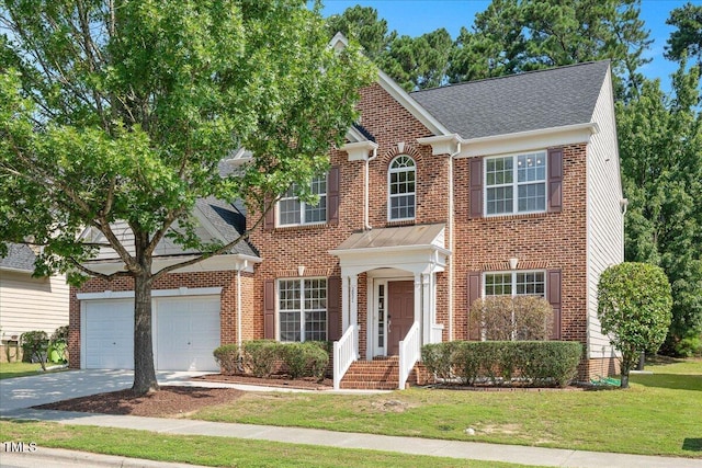 2021 Patapsco Dr, Apex, NC 27523 - colonial inspired home featuring concrete driveway, a front lawn, brick siding, and a garage