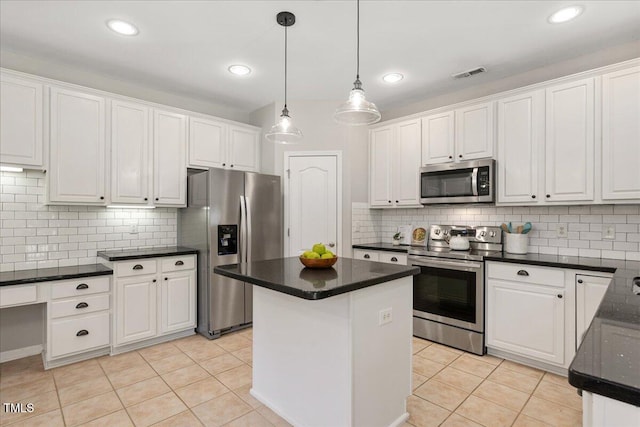 2021 Patapsco Dr, Apex, NC 27523 - kitchen featuring stainless steel appliances, white cabinetry, backsplash, a center island, and recessed lighting