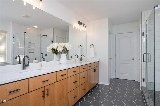 2021 Patapsco Dr, Apex, NC 27523 - full bathroom with double vanity, a shower stall, and tile patterned floors
