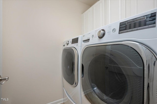 2021 Patapsco Dr, Apex, NC 27523 - laundry room featuring washer and clothes dryer and baseboards