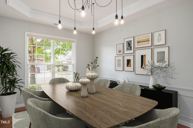 2021 Patapsco Dr, Apex, NC 27523 - dining space with crown molding, a tray ceiling, wood finished floors, and a chandelier