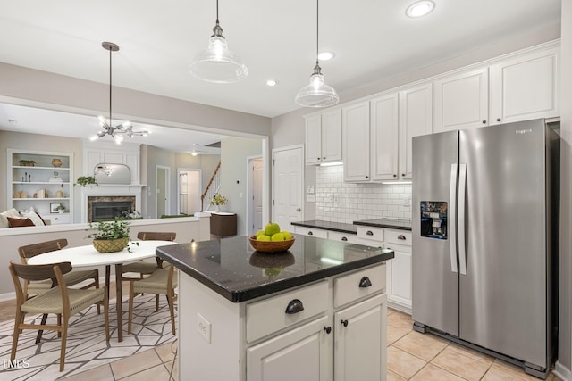2021 Patapsco Dr, Apex, NC 27523 - kitchen featuring stainless steel refrigerator with ice dispenser, light tile patterned floors, white cabinets, and recessed lighting