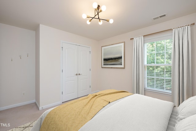 2021 Patapsco Dr, Apex, NC 27523 - bedroom featuring a chandelier, light carpet, and a closet