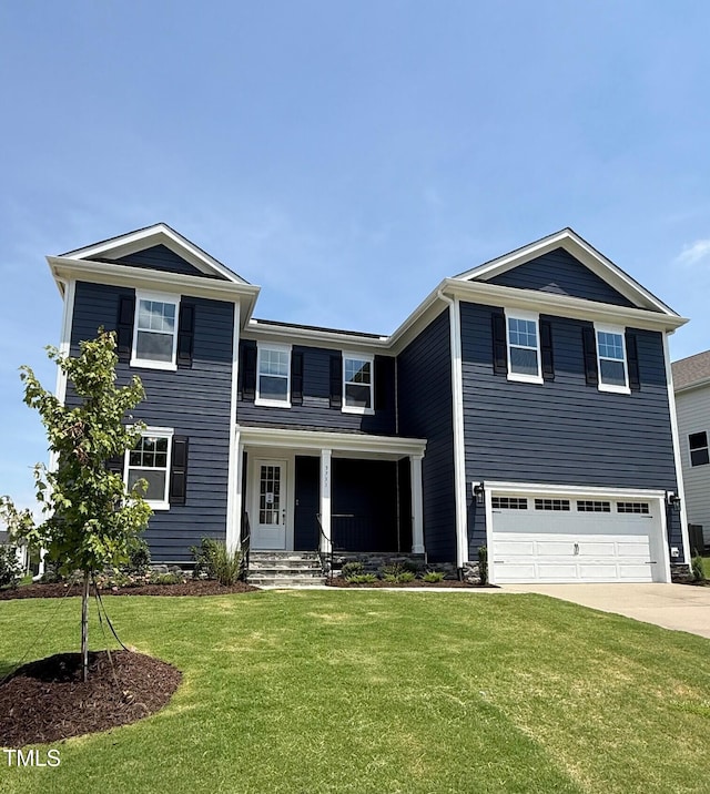 3731 Lebrun Path Unit 150Gunnison Cl, Fuquay Varina, NC 27526 - view of front of home with driveway, a garage, a front lawn, and a porch