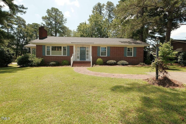1801 Bethlehem Rd, Rocky Mount, NC 27803 - ranch-style house with a chimney, brick siding, a front lawn, and entry steps