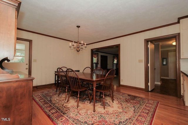 1801 Bethlehem Rd, Rocky Mount, NC 27803 - dining area featuring crown molding, wood finished floors, and a chandelier
