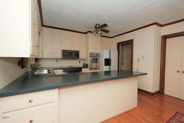 1801 Bethlehem Rd, Rocky Mount, NC 27803 - kitchen with black microwave, white fridge with ice dispenser, stainless steel oven, electric range, and a peninsula