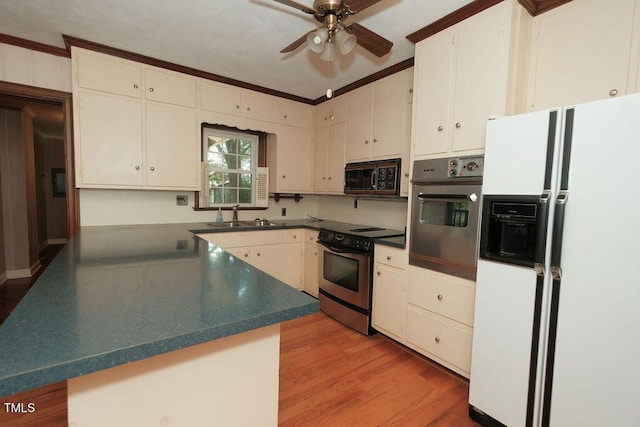 1801 Bethlehem Rd, Rocky Mount, NC 27803 - kitchen featuring stainless steel appliances, ceiling fan, light wood-type flooring, dark countertops, and white cabinetry