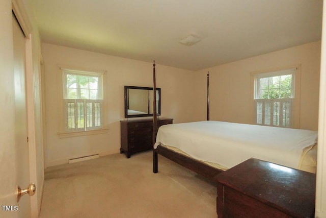 1801 Bethlehem Rd, Rocky Mount, NC 27803 - carpeted bedroom with a baseboard radiator and multiple windows