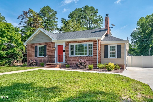 216 Whitfield St, Enfield, NC 27823 - bungalow-style house featuring a chimney, brick siding, and a shingled roof