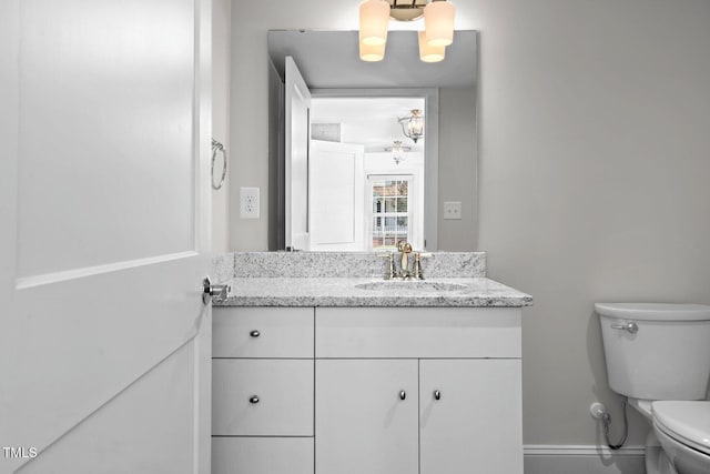 216 Whitfield St, Enfield, NC 27823 - bathroom featuring vanity and a chandelier