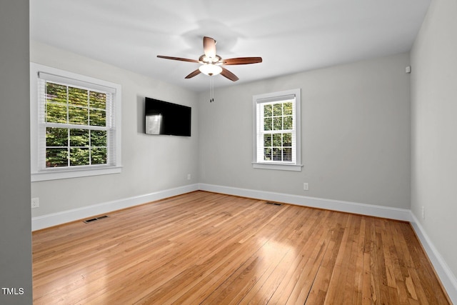 216 Whitfield St, Enfield, NC 27823 - spare room featuring plenty of natural light, ceiling fan, and light wood-style floors
