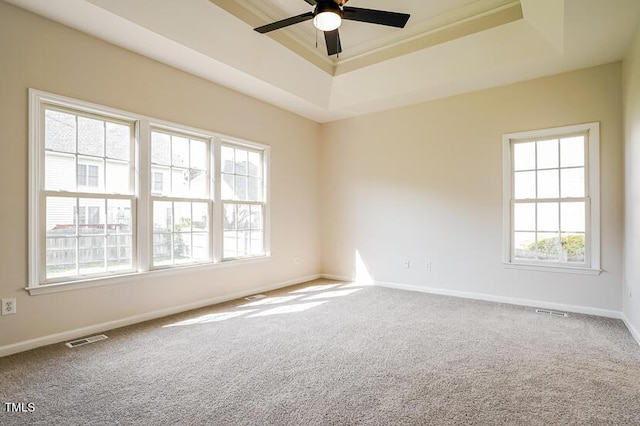 5933 Big Nance Dr, Raleigh, NC 27616 - carpeted empty room featuring a tray ceiling, a ceiling fan, and crown molding