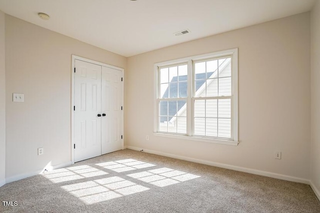 5933 Big Nance Dr, Raleigh, NC 27616 - unfurnished bedroom featuring carpet floors and a closet