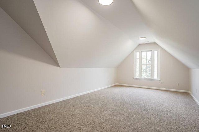 5933 Big Nance Dr, Raleigh, NC 27616 - additional living space with vaulted ceiling and carpet