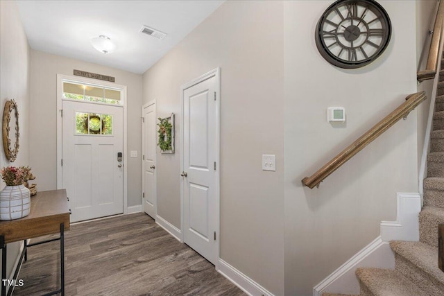 1119 Latitude Dr, Durham, NC 27713 - foyer entrance with wood finished floors and stairs