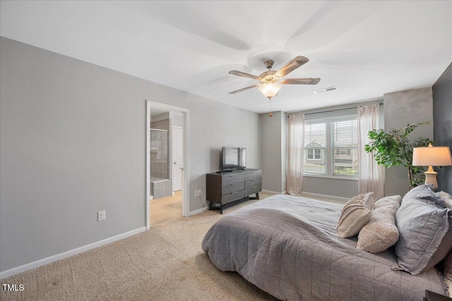1119 Latitude Dr, Durham, NC 27713 - bedroom with light colored carpet, a ceiling fan, and connected bathroom