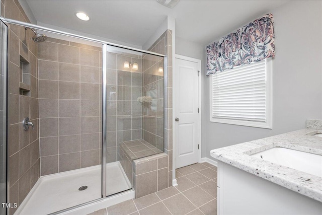 1119 Latitude Dr, Durham, NC 27713 - full bathroom with vanity, a shower stall, tile patterned flooring, and recessed lighting