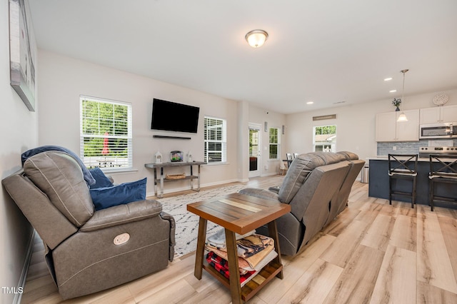 3922 Cross Timber Ln, Raleigh, NC 27603 - living area featuring light wood finished floors and recessed lighting