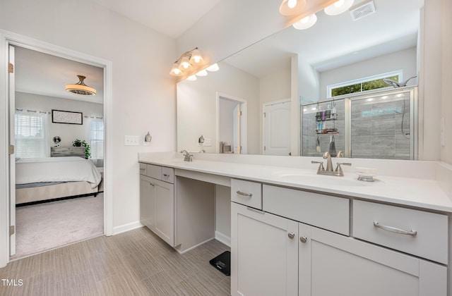 3922 Cross Timber Ln, Raleigh, NC 27603 - bathroom with double vanity, a stall shower, and connected bathroom