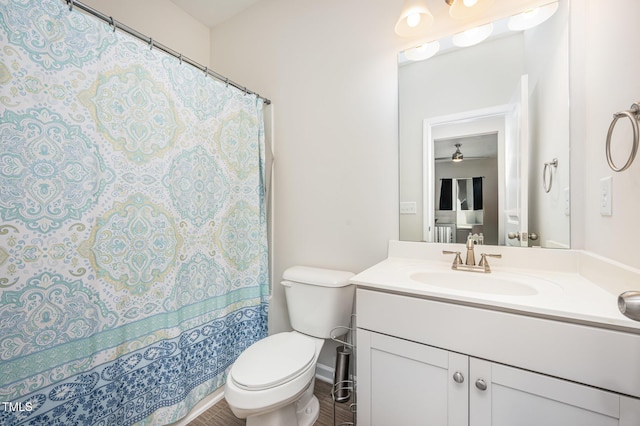 3922 Cross Timber Ln, Raleigh, NC 27603 - full bathroom with vanity, a ceiling fan, curtained shower, and wood finished floors