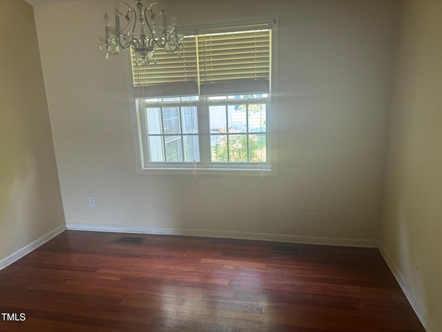 165 Cambridge Elm Dr, Clayton, NC 27520 - unfurnished room with hardwood / wood-style floors and a chandelier